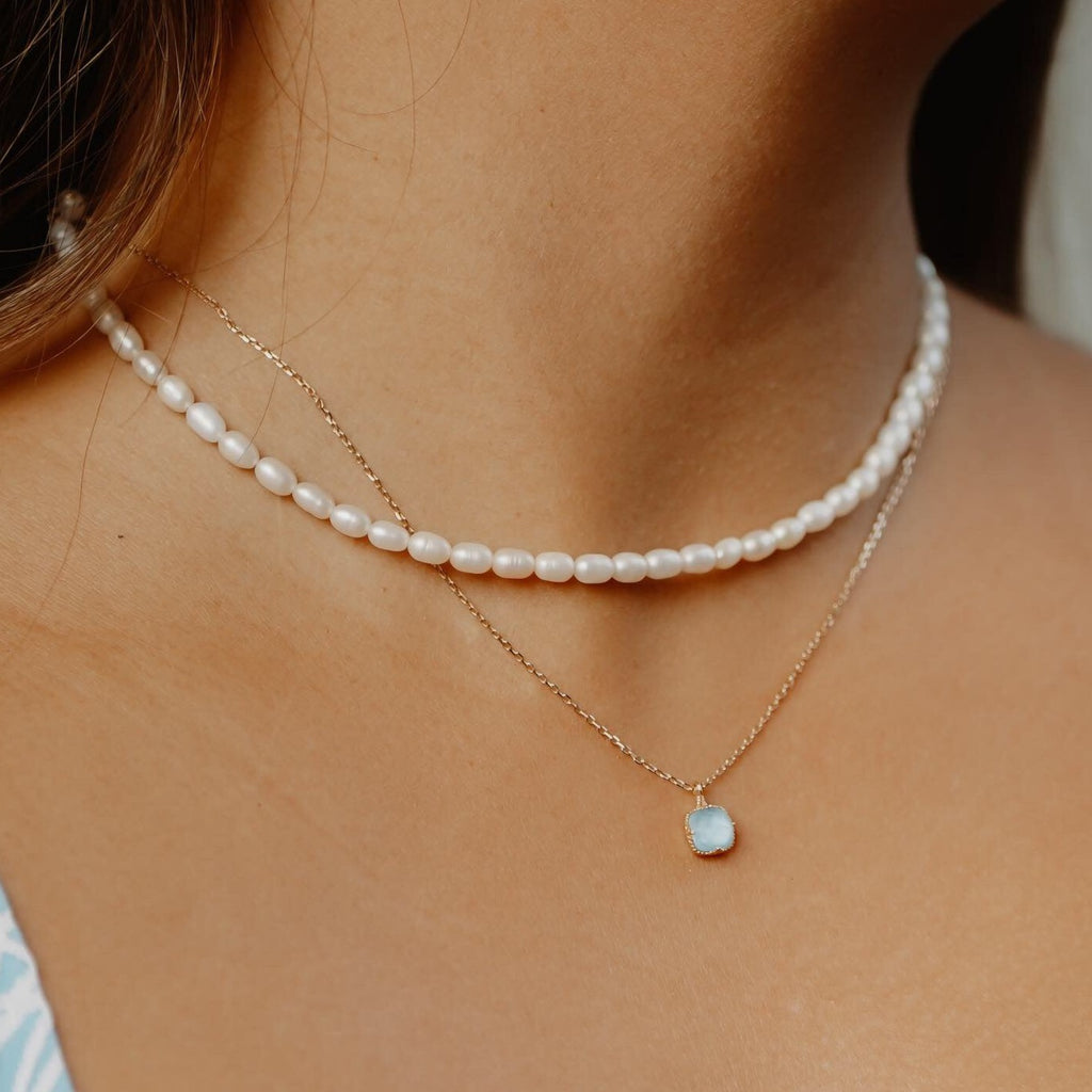 Aquamarine gemstone necklace in gold vermeil worn at the neck