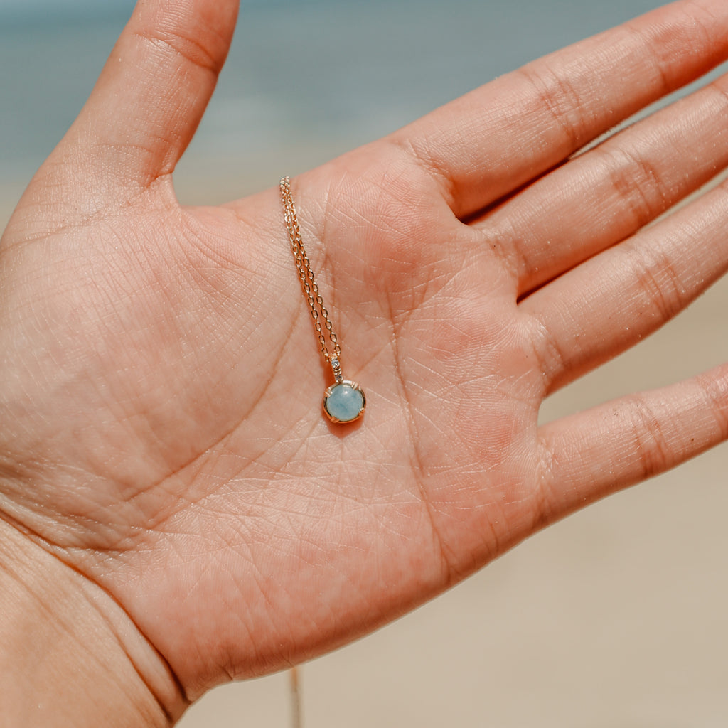 Aquamarine gemstone necklace in gold vermeil worn at the neck