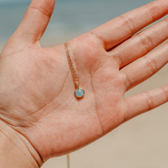 Aquamarine gemstone necklace in gold vermeil worn at the neck