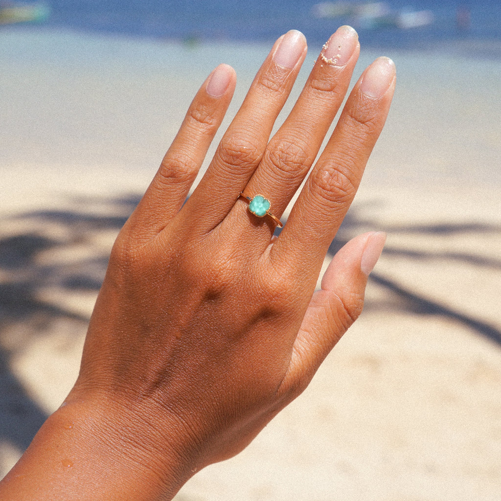 Aquamarine gemstone ring in gold vermeil worn on a hand