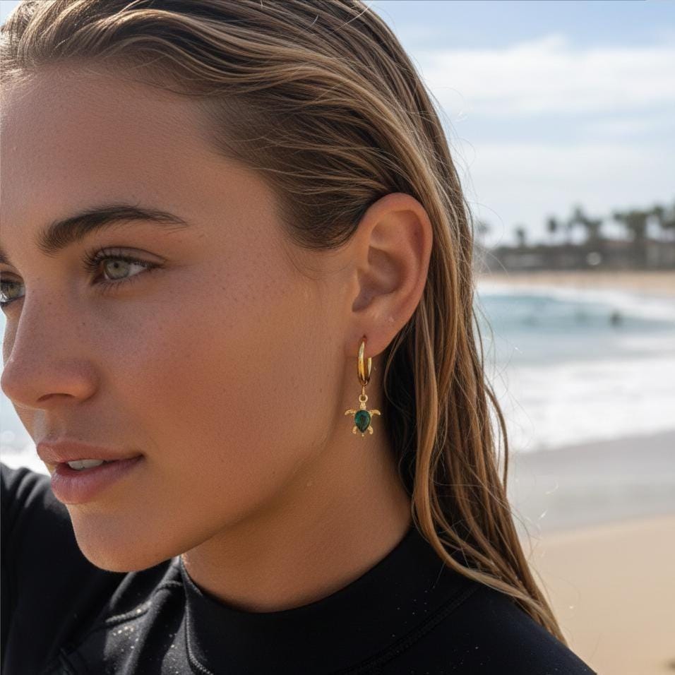 Gold Sea Turtle Huggie Earrings, worn view