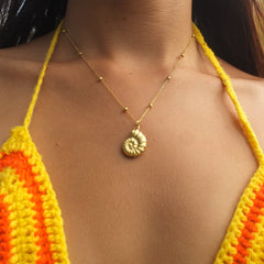 Sea Snail Charm Necklace, worn view